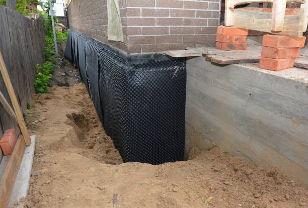SJ Waterproofing Pros technician performing targeted Foundation Crack Repair assessment in Laurel, IN